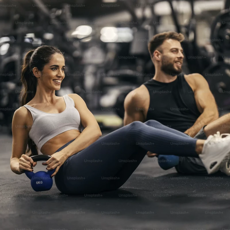 An energetic couple working out at Harbor Athletic
